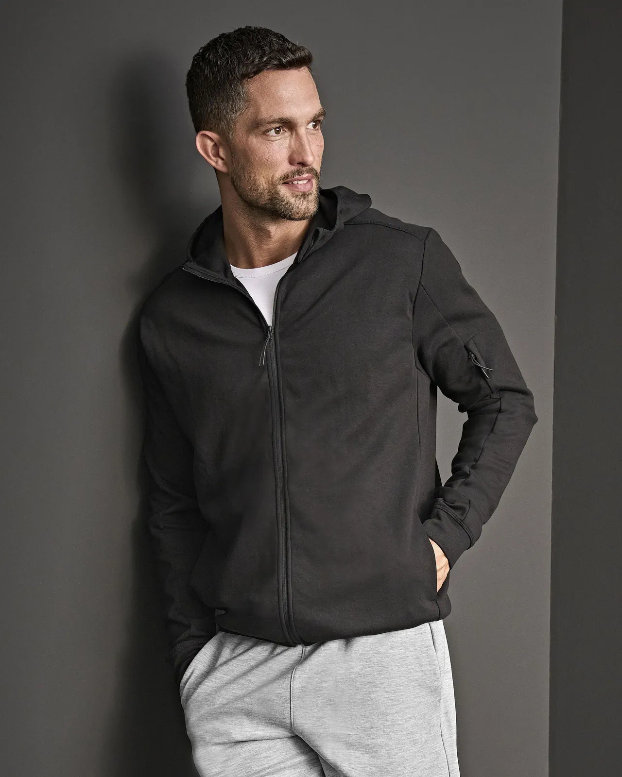 tee-jays-5706-athletic-hooded-full-zip-sweatshirt-black-model-0 Tee Jays Athletic Hooded Full Zip Sweat