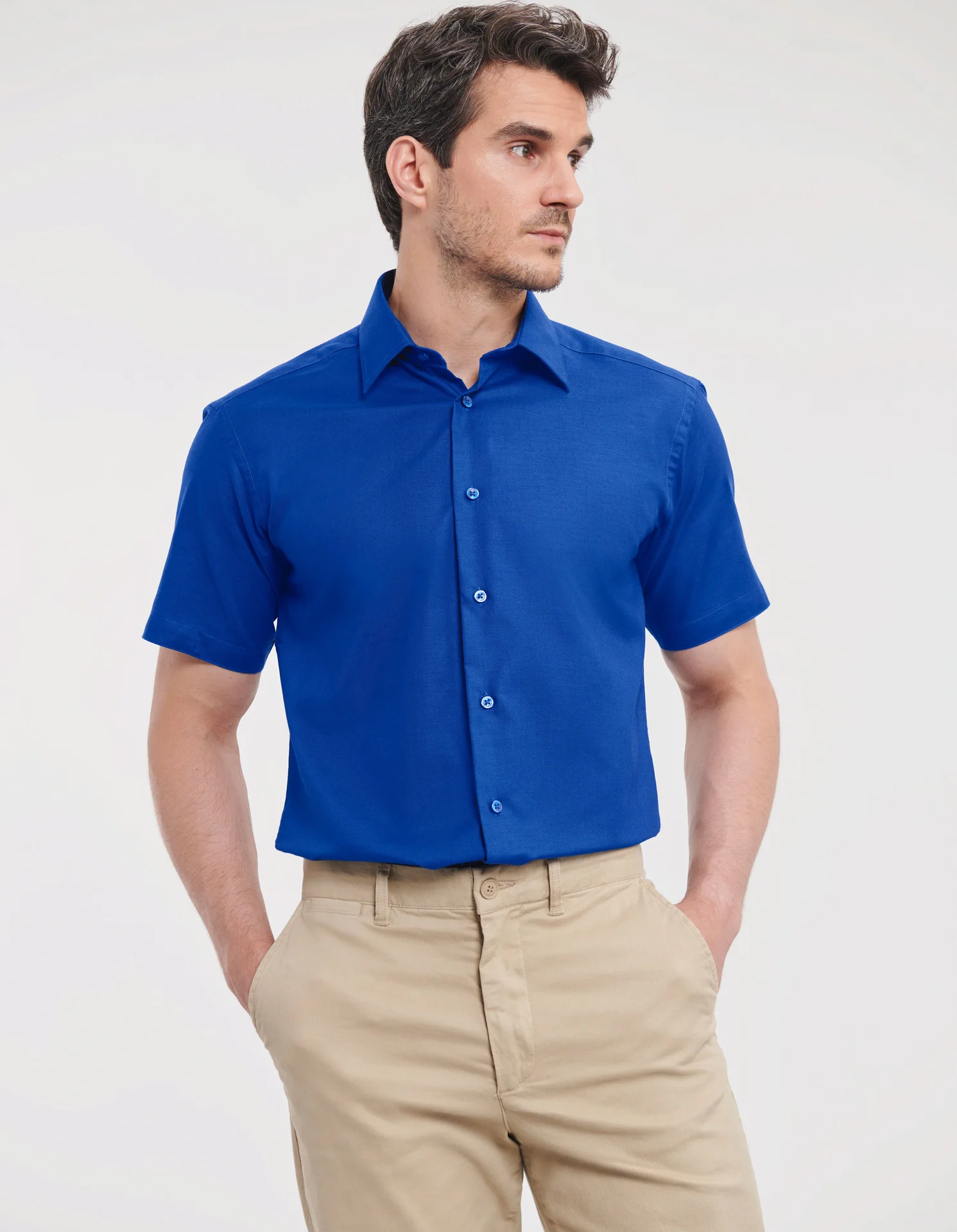 russell-r923m-mens-short-sleeve-easy-care-tailored-oxford-shirt-brightroyal-model-1 Russell Men's Short Sleeve Easy Care Tailored Oxford Shirt