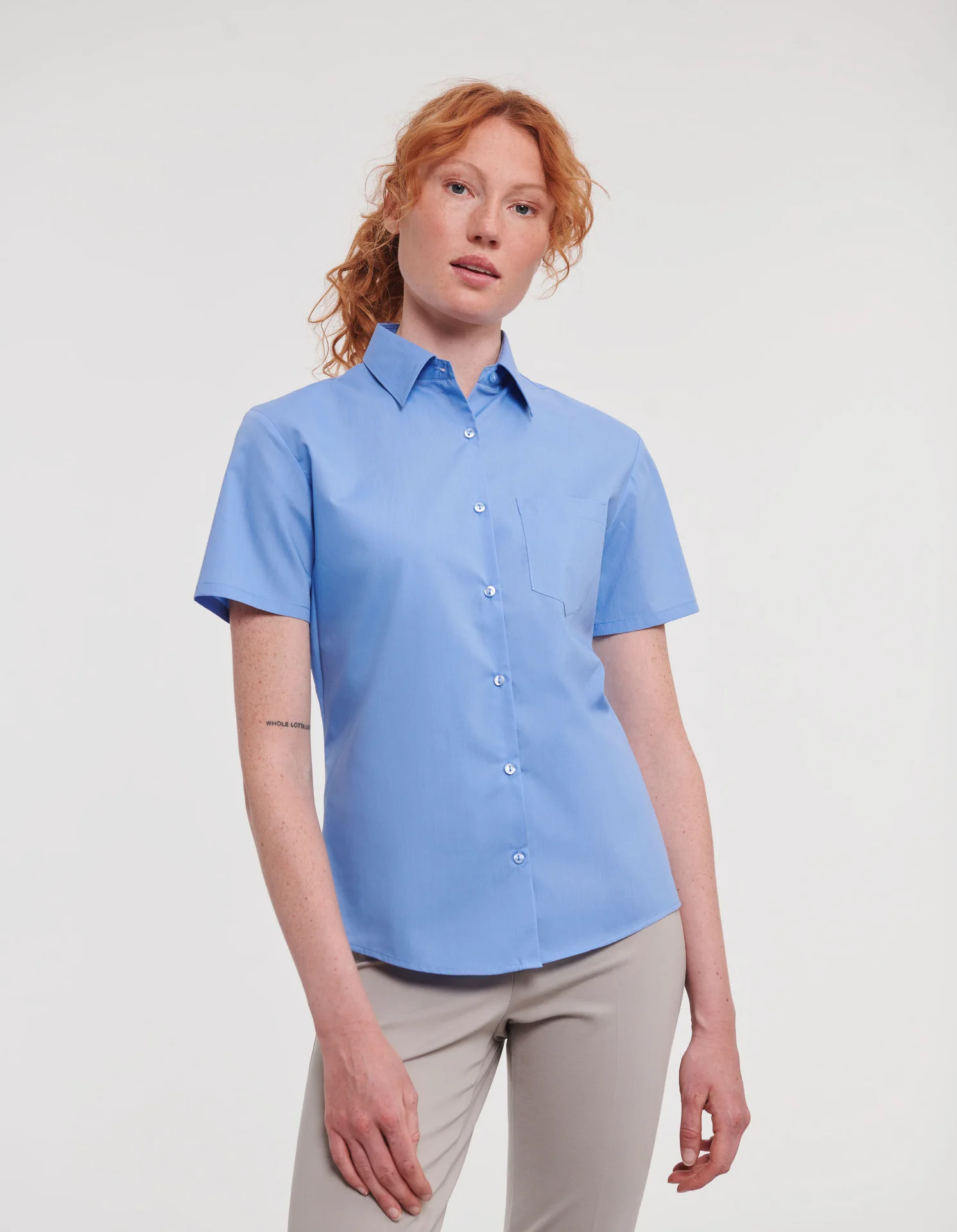 russell-r935f-ladies-short-sleeve-poly-cotton-easy-care-poplin-shirt-corporateblue-model-1 Russell Ladies Short Sleeve Polycotton Easy Care Poplin Shirt