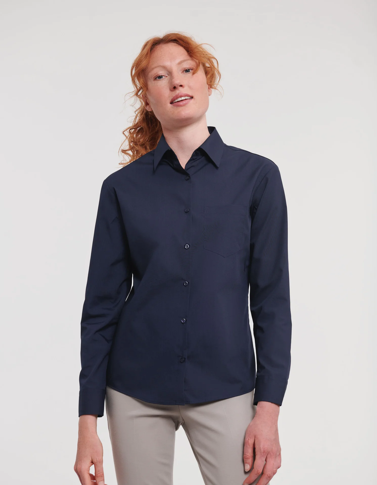russell-r934f-ladies-ls-poly-cotton-easy-care-poplin-shirt-frenchnavy-model-1 Russell Ladies Long Sleeve Polycotton Easy Care Poplin Shirt