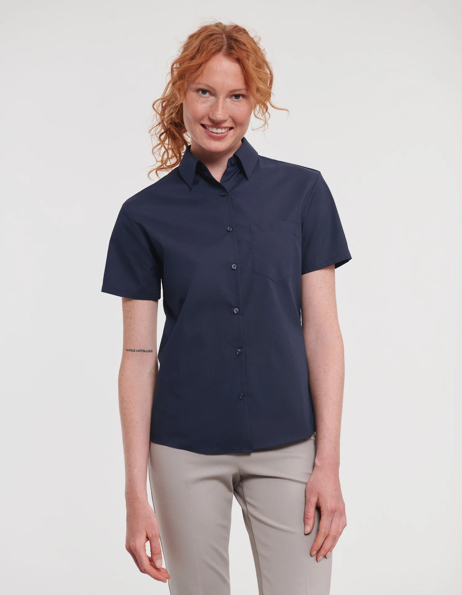 russell-r935f-ladies-short-sleeve-poly-cotton-easy-care-poplin-shirt-frenchnavy-model-1 Russell Ladies Short Sleeve Polycotton Easy Care Poplin Shirt
